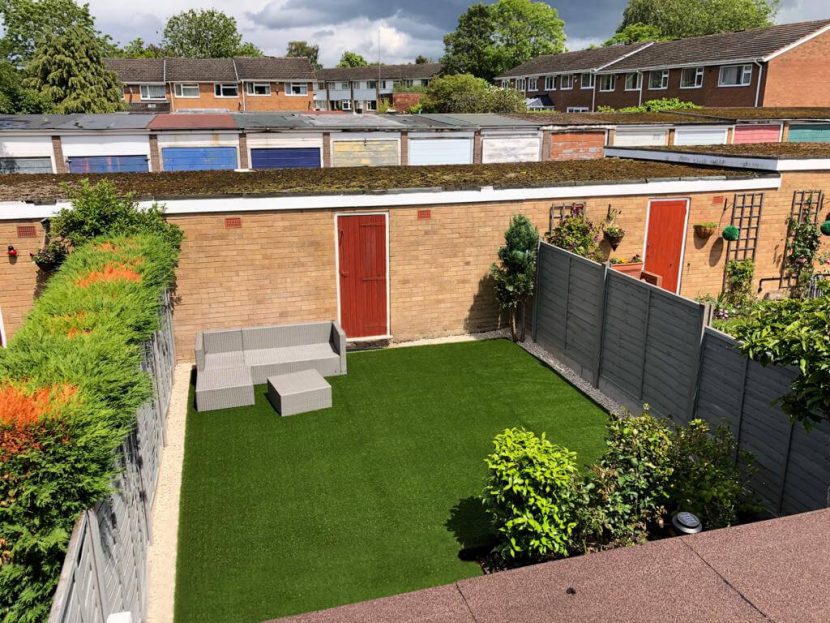 Square of Green Frog Artificial Grass installed in a small walled garden