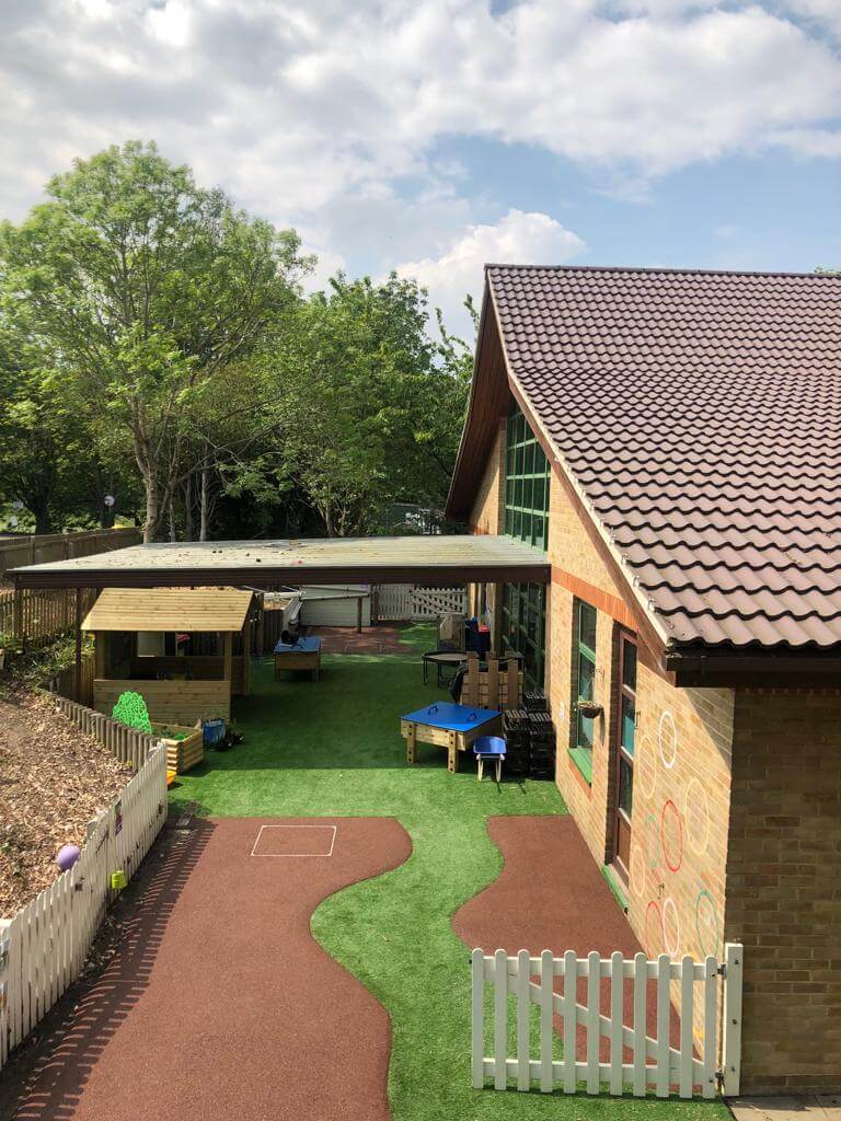 Artificial Grass pathway through rubber mulch surface