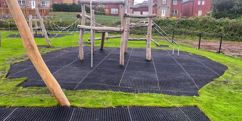 Rubber Grass Mats on Playground EcoSmart grass protector matting underneath wooden playground equipment