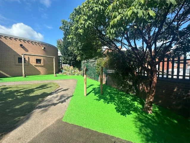 Vibrant Green EPDM Mulch Vibrant green EPDM Mulch under school playground equipment